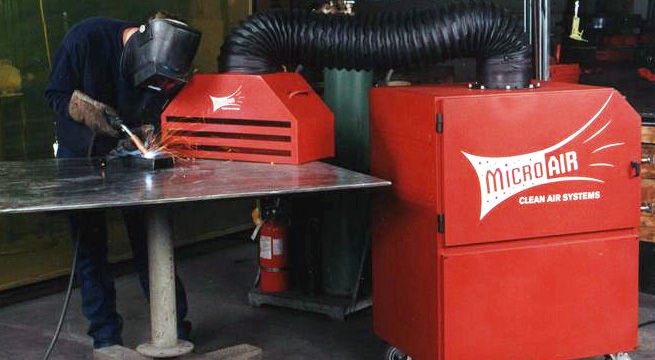 Micro Air TM1000 equipped with backdraft hood removes smoke and fumes from the work area.