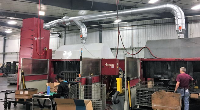 MICRO AIR FRP8 ducted to two large robotic weld hoods.  Each hood is equipped with an electric duct damper that opens only when weld station is in use. 