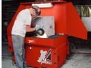 Micro Air XA34 self-contained Downdraft Table captures grinding dust and particulate.